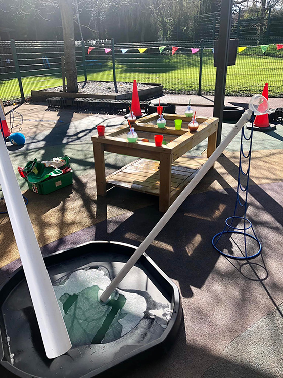 smiley faces nursery outside water play